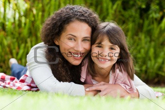 Adorable mother with her daughter in the garden