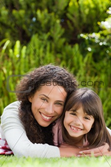 Adorable mother with her daughter in the garden