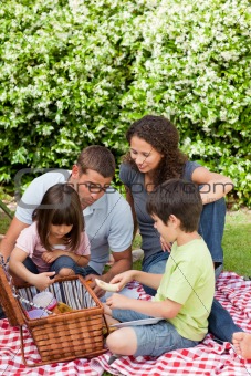 Family picnicking in the garden 