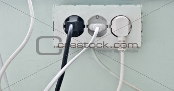 The old socket with three plugs