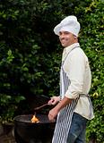 Man having a barbecue in the garden 