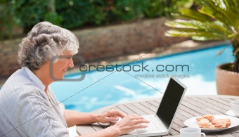 Mature woman working on her laptop