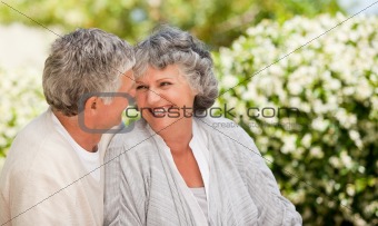 Woman looking at her husband in the garden