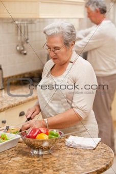 Senior couple cooking in the kitchen