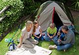 Happy family camping in the garden