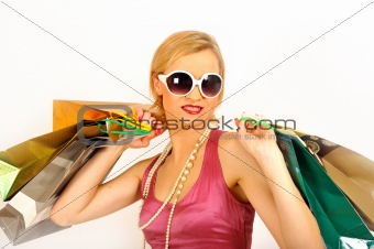 Young beautiful shopping woman with lots of shopping bags.