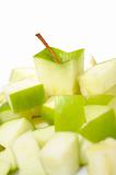 fresh green apple cut into slices. isolated on white background