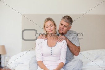 Man giving a massage to his wife