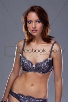 A beautiful woman with a bra and slip