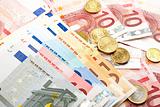 Euro banknotes with coins, financial background 