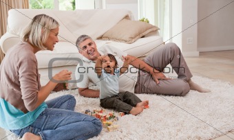 Son playing with his parents 