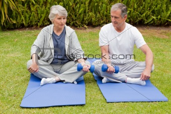 Retired couple doing their streches