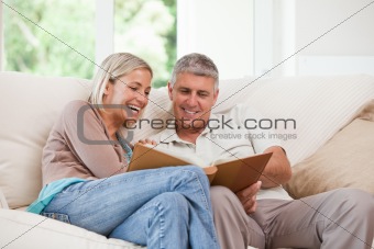 Couple looking at their photo album