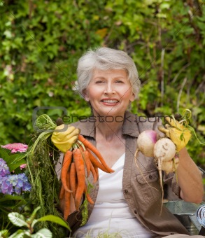 Retired woman working in the garden