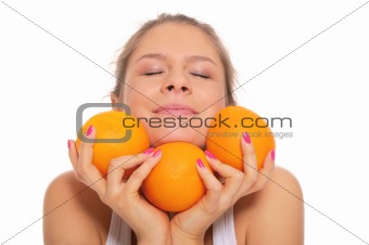 Beautiful smiling woman with oranges