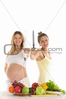 happy woman with fruit, blender and a knife