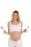 pregnant woman with a spoon and fork