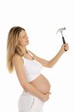 pregnant woman works with a hammer