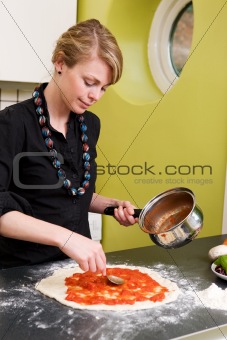 Young Woman Making Pizza