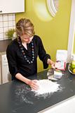 Woman Kneading Dough at Home