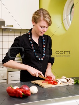 Woman Cutting Vegetables at Home