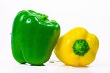The isolated green and yellow pepper with drops of water