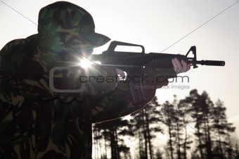Soldier, his Rifle and the Sun
