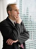 Businessman thinking by the window