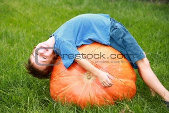 Boy Playing on Pumpkin