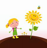 Spring gardening : Gardener child with sunflower in the garden