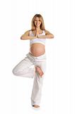 Pregnant woman practicing yoga, standing