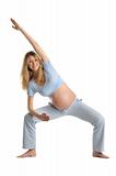 Pregnant woman practicing yoga, standing