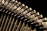 Close-up of old typewriter letter and symbol keys 