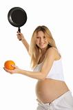 Pregnant woman playing tennis orange and pan