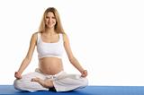Pregnant woman practicing yoga, sitting