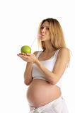 pregnant woman drinking juice from apple