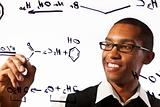 Young man works on chemistry problem