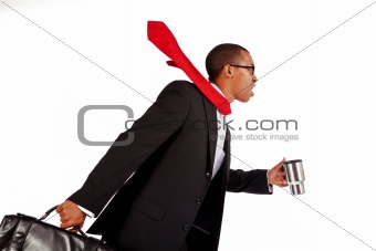 Businessman runs with his coffee