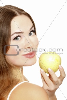 Portrait of a pretty young woman with an apple