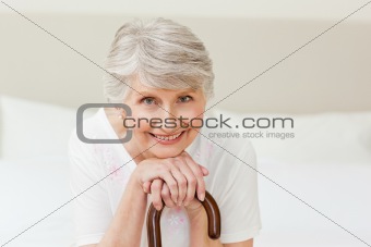 Retired woman with her walking stick 