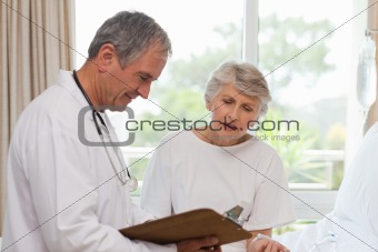 Mature doctor with his patient