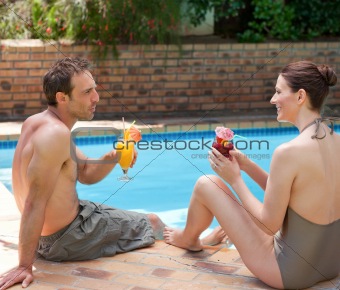 Happy couple drinking cocktails