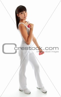 Pretty young woman using hand weights during fitness workout
