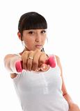 Young woman using hand weights