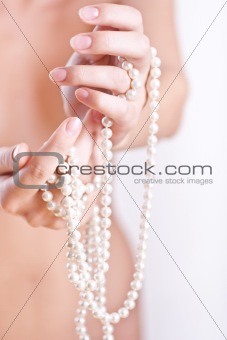 pearls in the women's hands