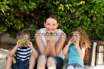 Happy family picnicking in the garden 