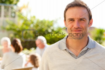 Man looking at the camera in the garden