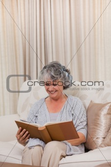 Senior looking at her photo album 