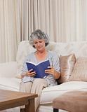Senior woman reading her book