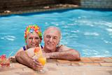 Happy mature couple in the swimming pool 
